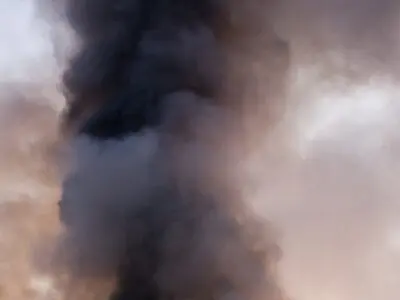 billowing plumes of gray and black smoke