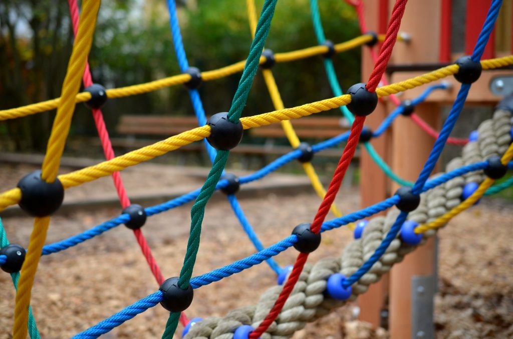 colorful rope climb at playground