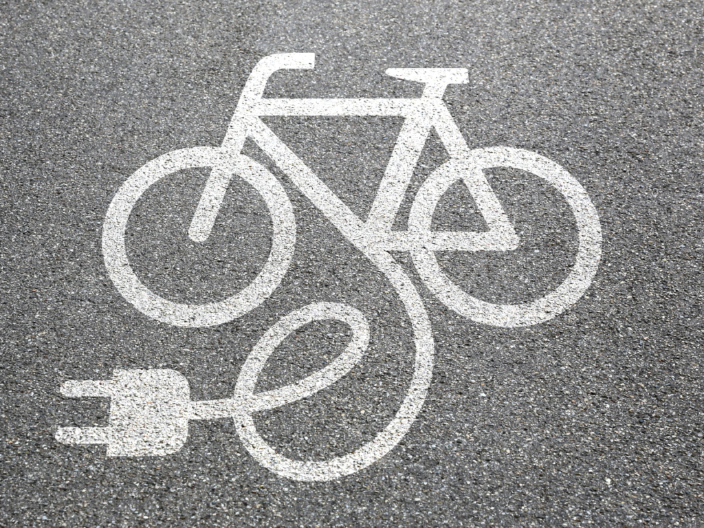 Painting of an electrical bike on pavement