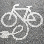Painting of an electrical bike on pavement
