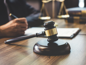 A judges gavel on a desk.